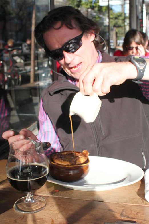 David Jayne pours caramel over his coffee cake, washed down with strong beer month's Rye Rye Rocco. Feb. 19, 2014. Photo by Drake 